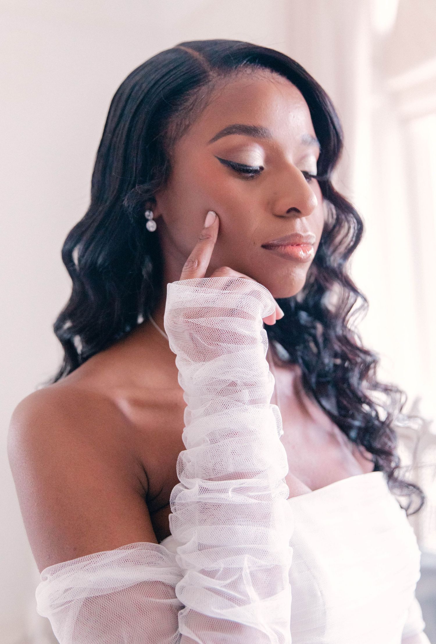 Close-up portrait shots showing delicate white lace sleeves against a bright background.