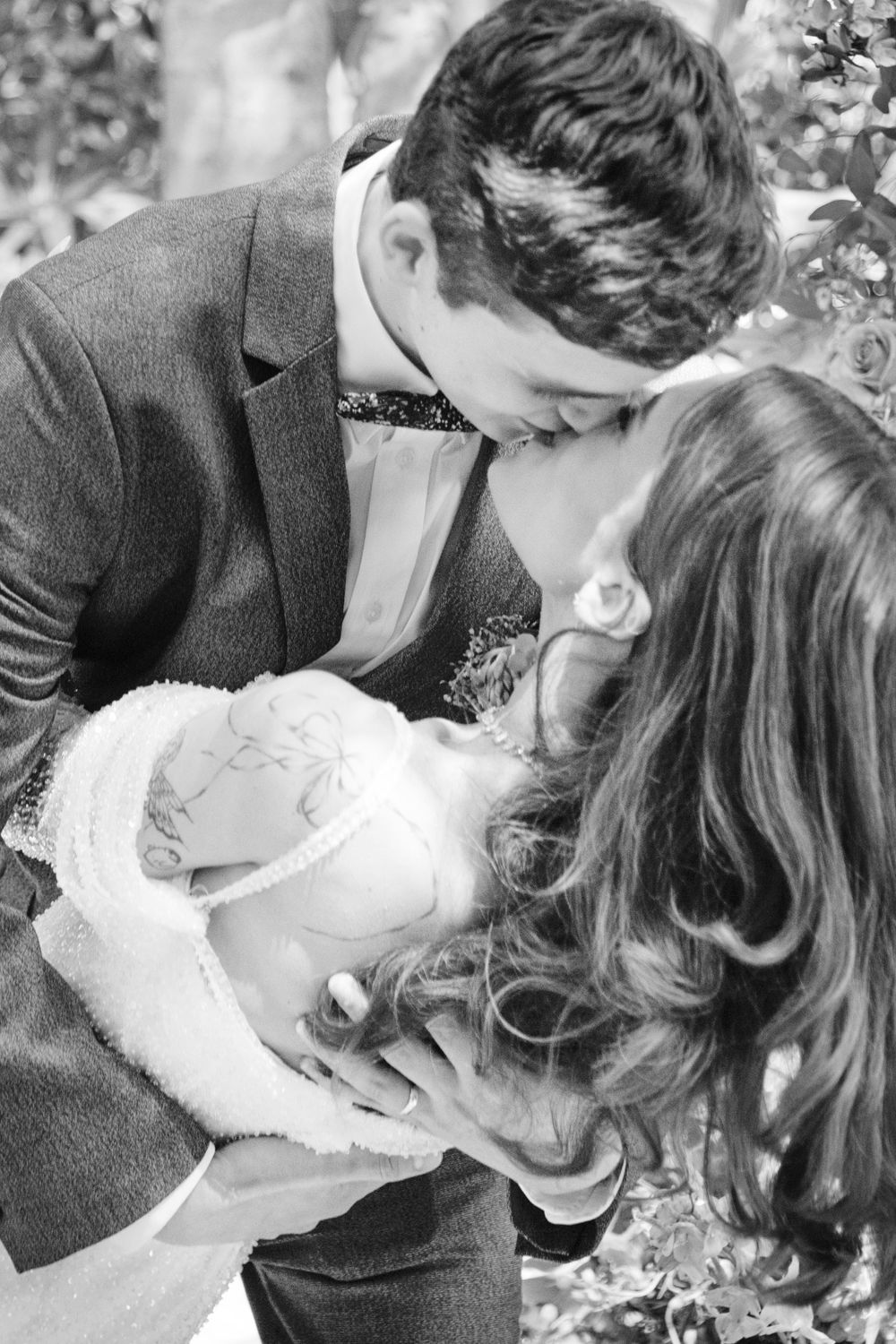 Black and white wedding couple sharing an intimate moment, timeless wedding photography
