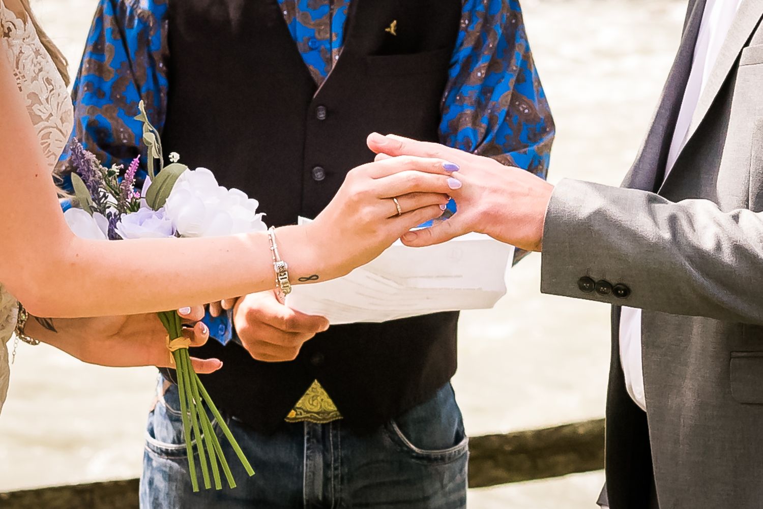 Exchanging rings during the ceremony in Hope, B.C. Photo by Kari Mills Photography, Vancouver wedding photographer.