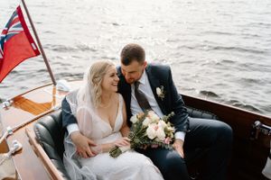 Couple touring the lake in an antiques wooden boat- Lake Joseph, Muskoka- Alexis Anne Photography