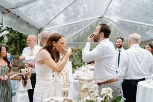 Bride and groom having oysters during wedding reception on Lake Muskoka- Alexis Anne Photography