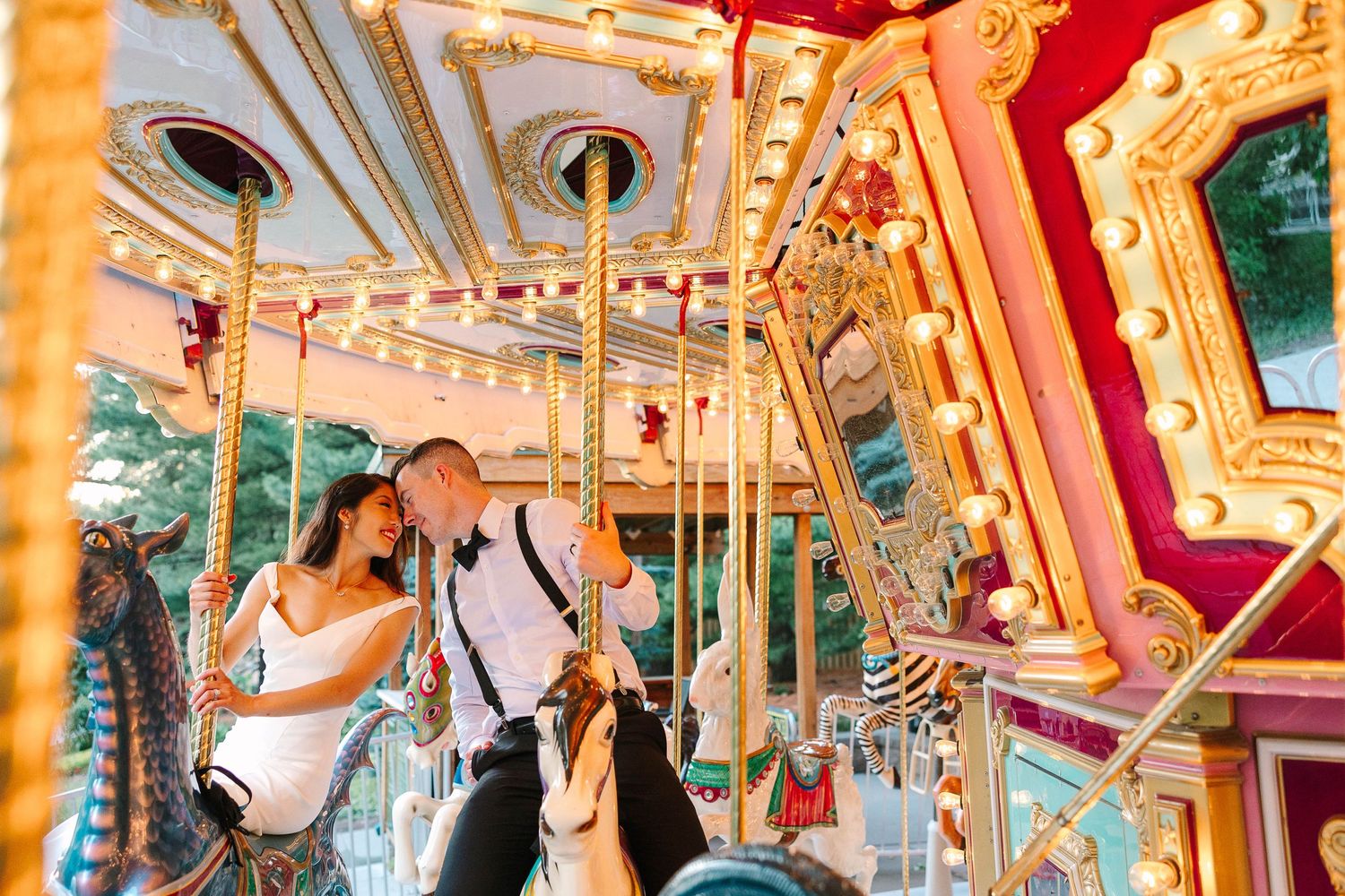 Sunset wedding photos at the Des Moines Blank Park Zoo carousel