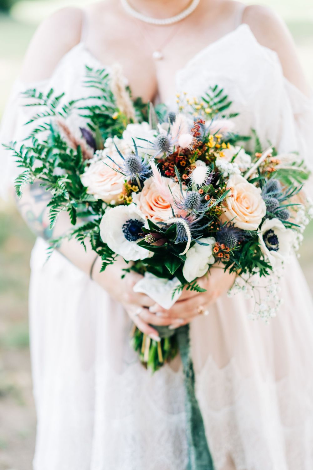 Wedding reception detail with table setting and florals