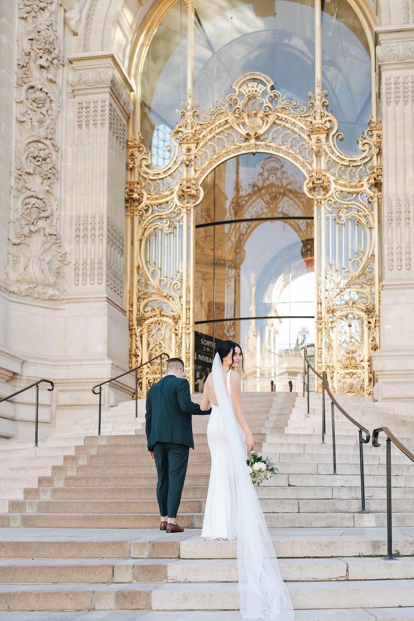 Couple outside of their wedding venue during their elopement in Paris