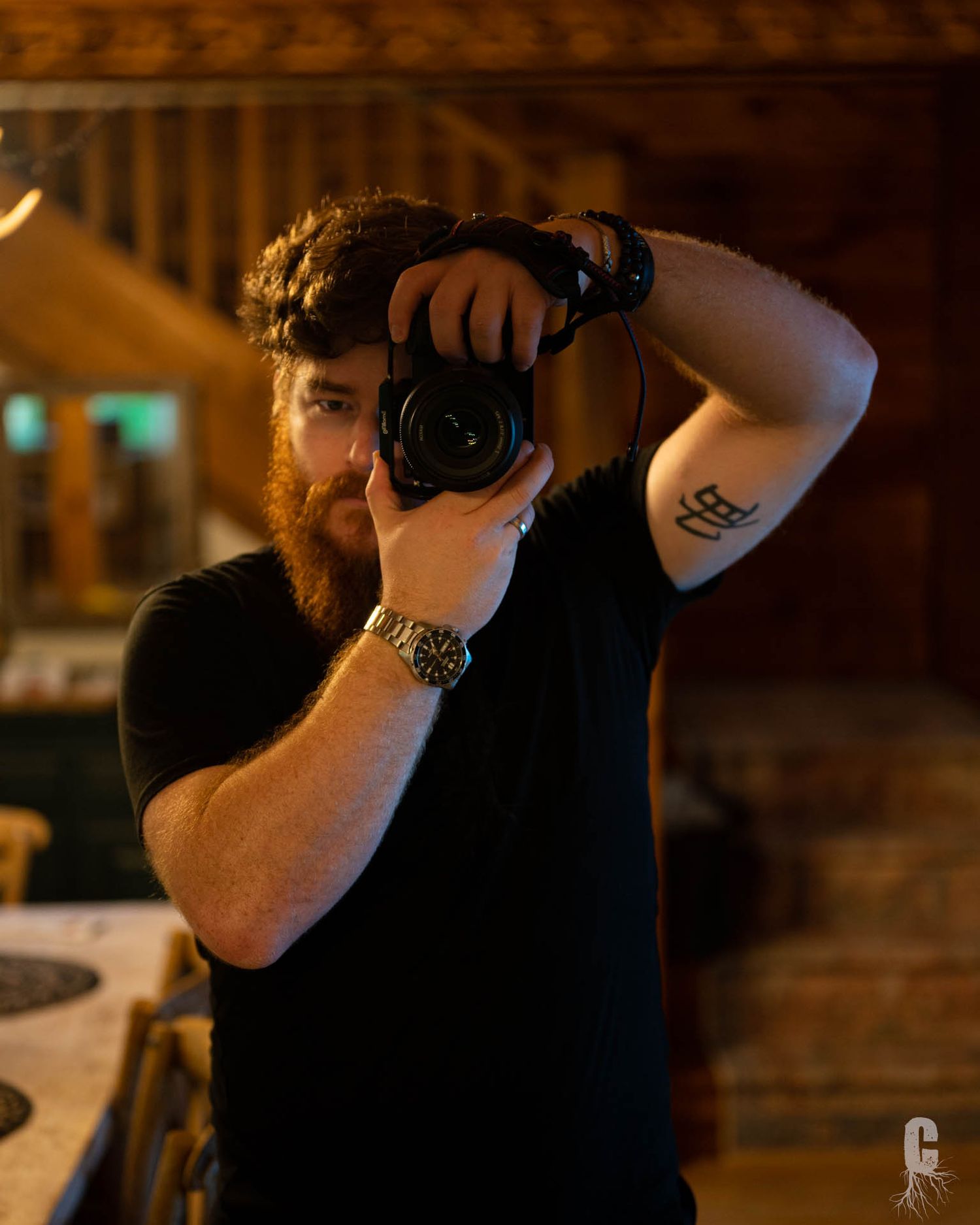 A boudoir photographer taking a self portrait into a mirror