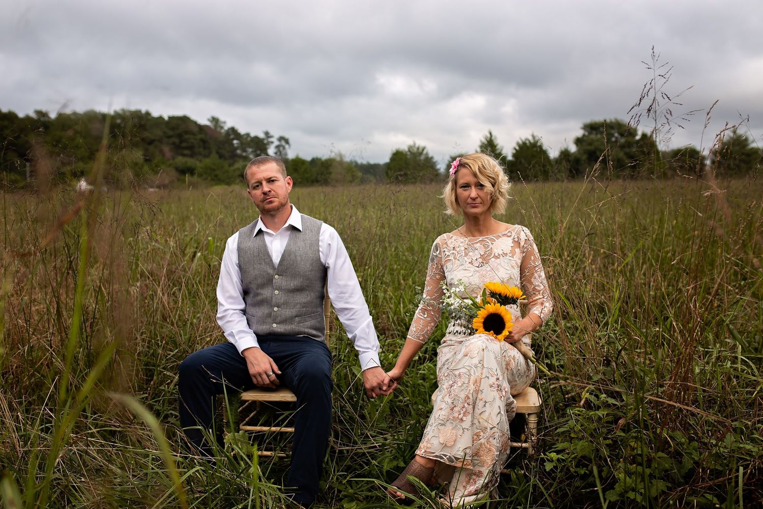 couple sitting in chairs in an overgrown field in virginia small intimate wedding elopement photographer