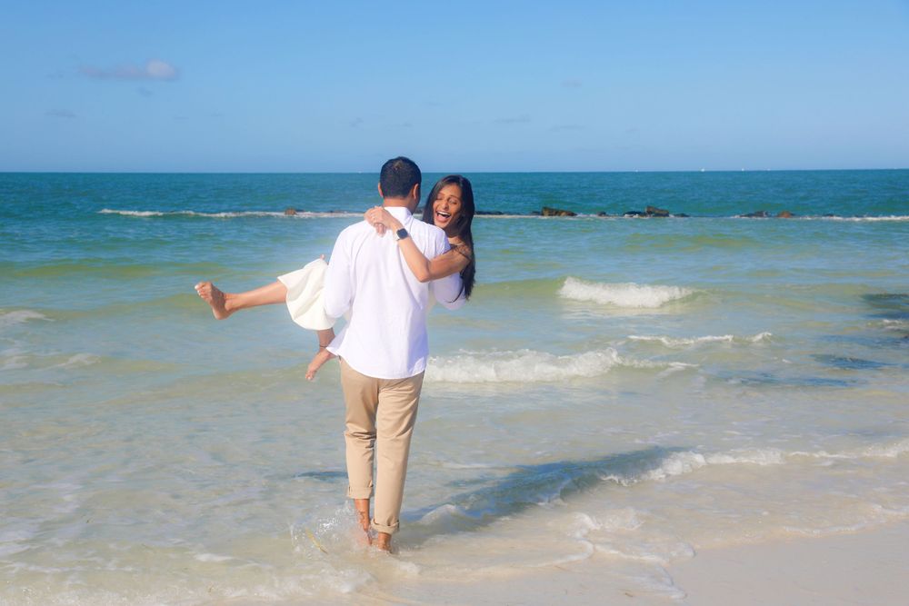 Engagement Photography – Romantic Coastal Embrace in Crystal Blues

This tender engagement portrait captures a serene and heartfelt moment