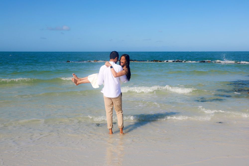 Engagement Photography – Romantic Coastal Embrace in Crystal Blues

This tender engagement portrait captures a serene and heartfelt moment