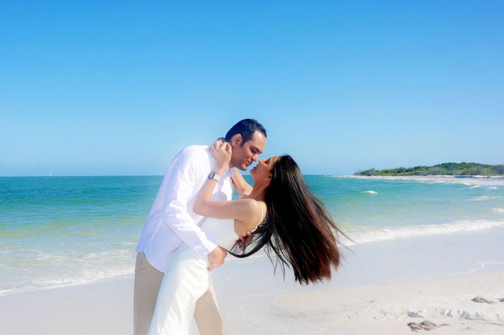 Engagement Photography – Playful Beach Moment in Engagement Session
