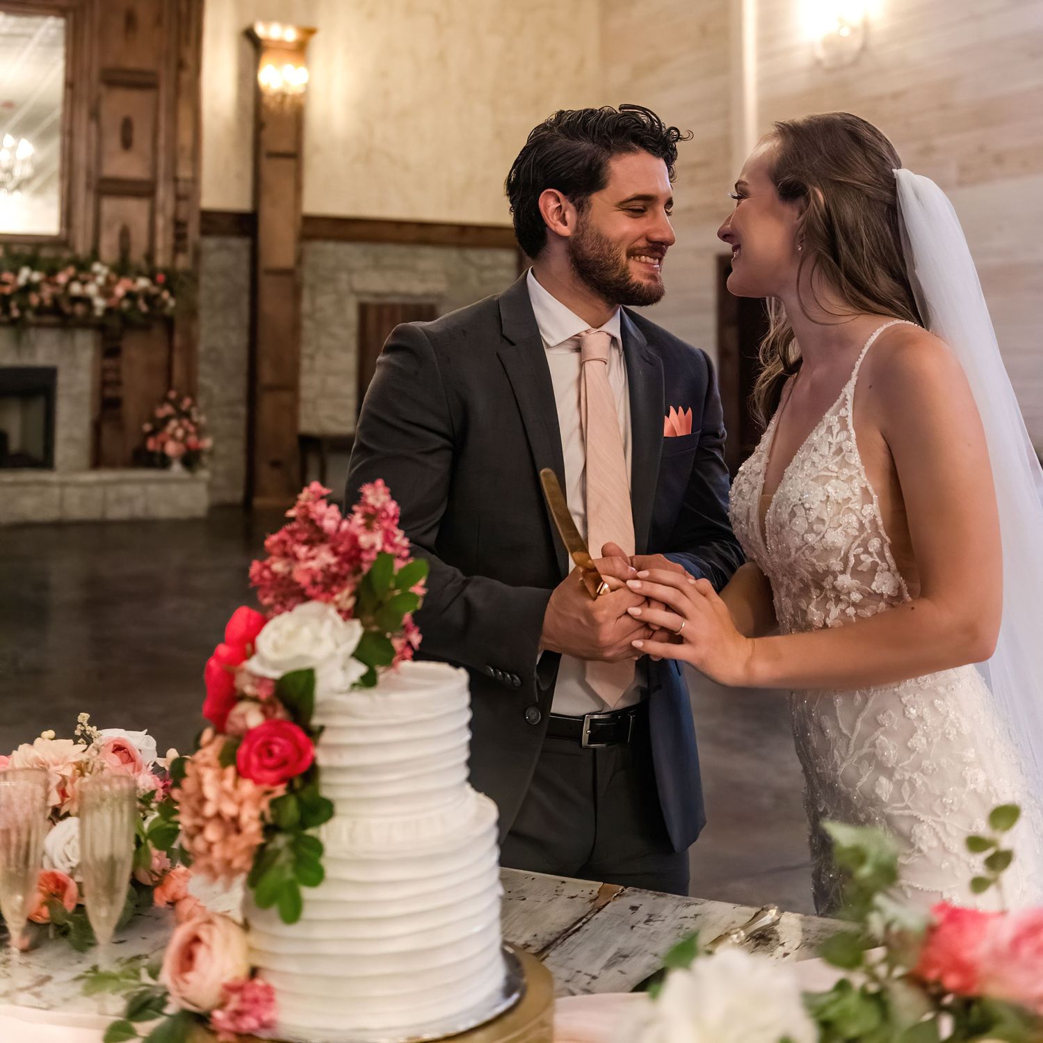 Indianapolis Indiana wedding photographer captures cake cutting by Jayme Riggleman Photography at Tayvin Gardens