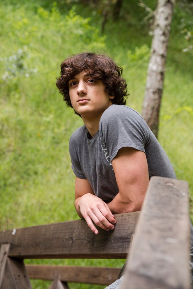 close up of a teenager with strong facial features looking to the distance