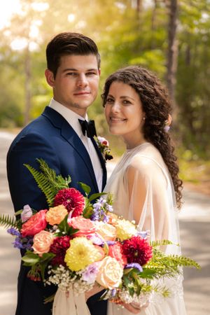 A bride and groom, hands entwined, with the bridal bouquet as a centerpiece, symbolizing their love and unity on their w