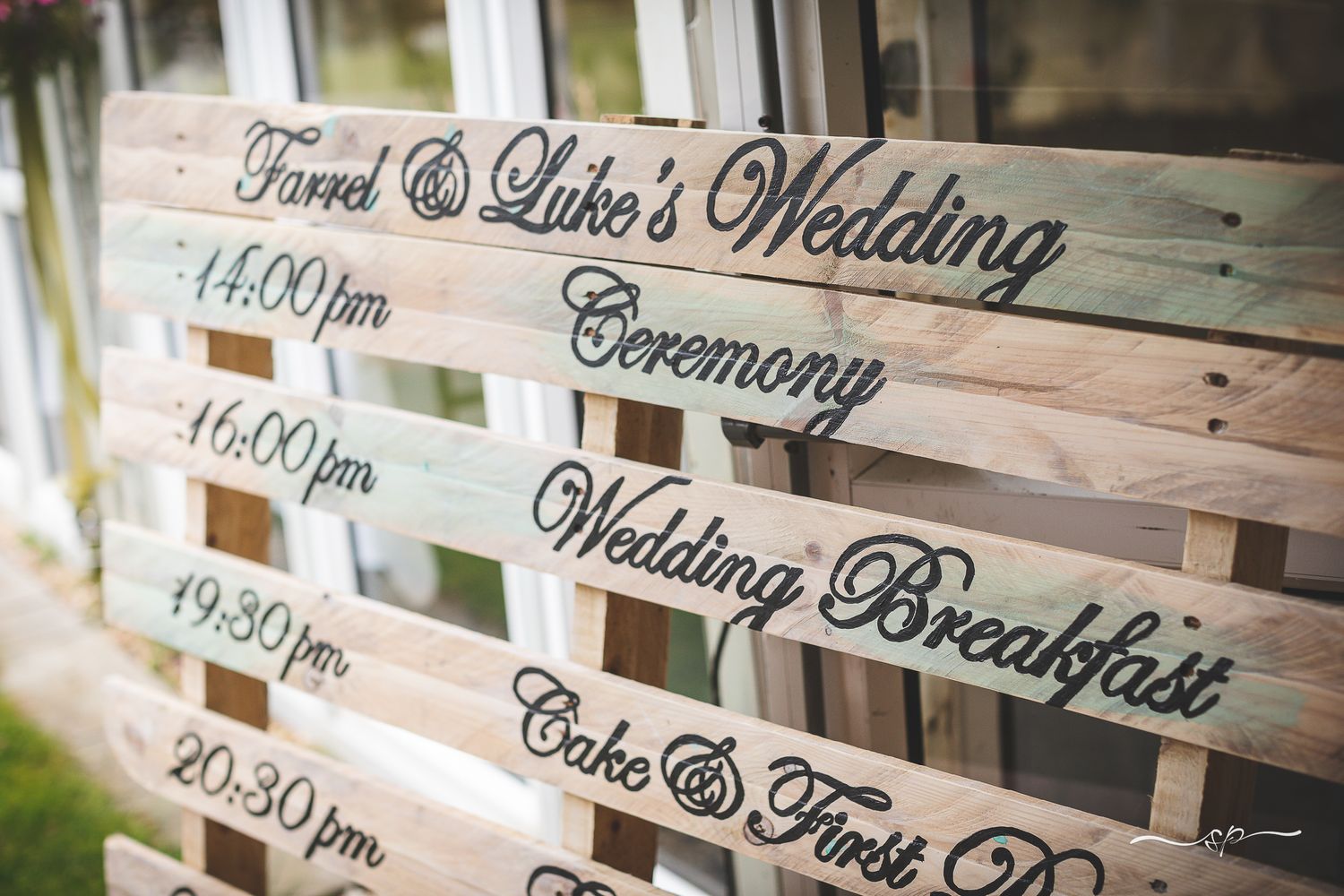 Hand Made wooden pallet wedding day plan for the guests.
