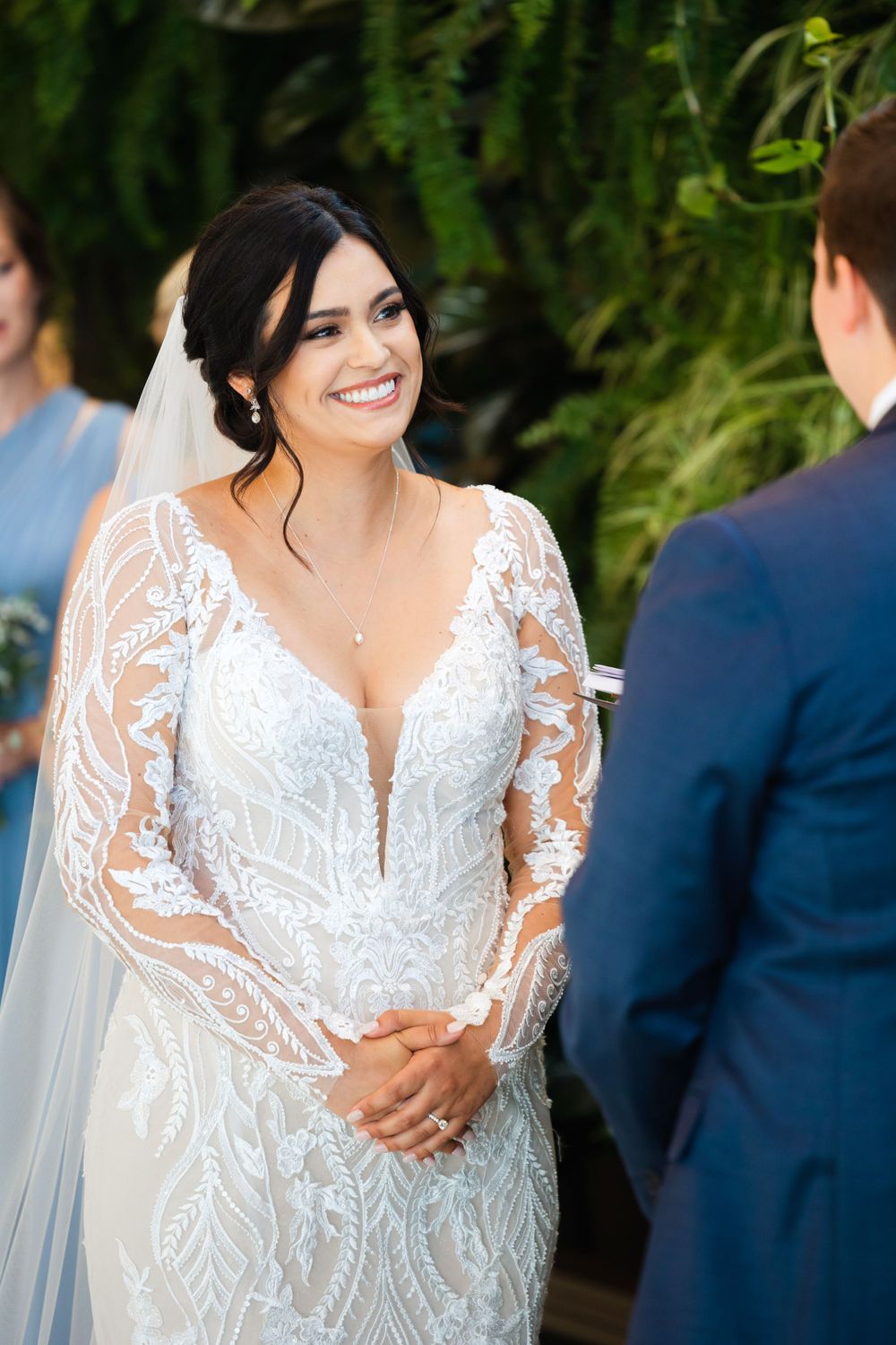 Bride smiles at groom during wedding at Jorgensen Farms in Westerville, Ohio.