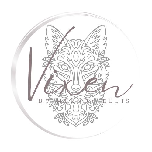 Circular logo design featuring an ornate wolf head illustration with stylized text 'Vixen' in metallic silver tones.