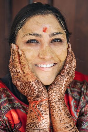 Portrait of an Indian bride with turmeric paste on her face during the haldi ceremony in Redondo Beach, California