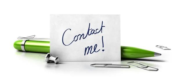 Contact me note with green pen and paper clips on white surface.