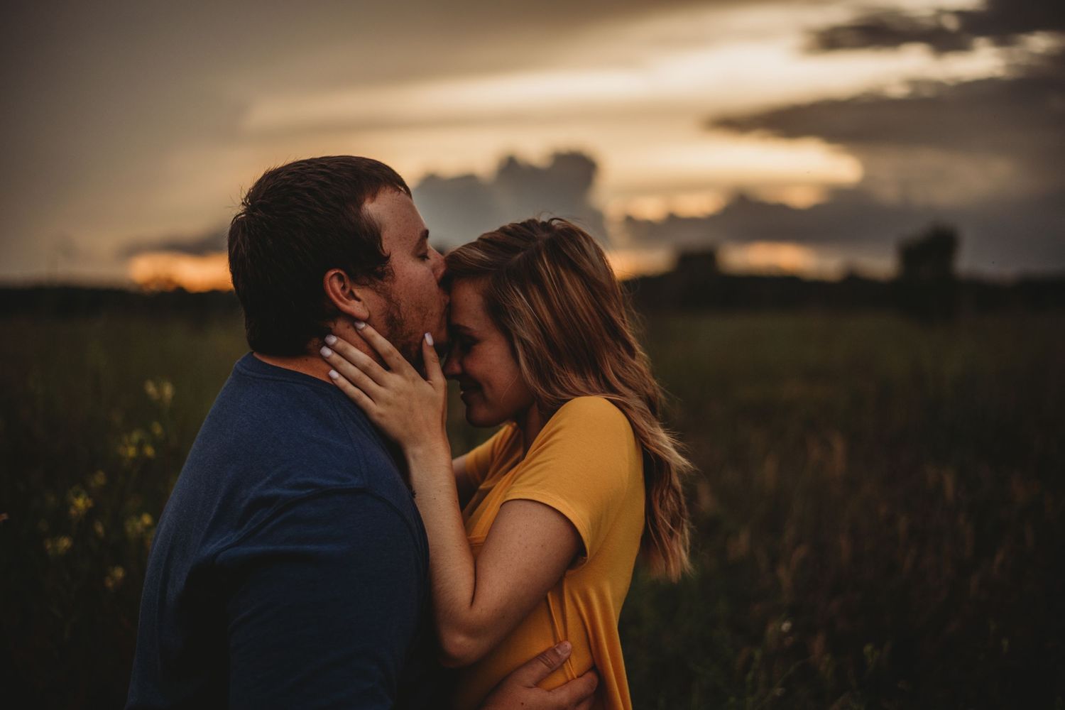 forehead kiss during golden hour before a storm hits