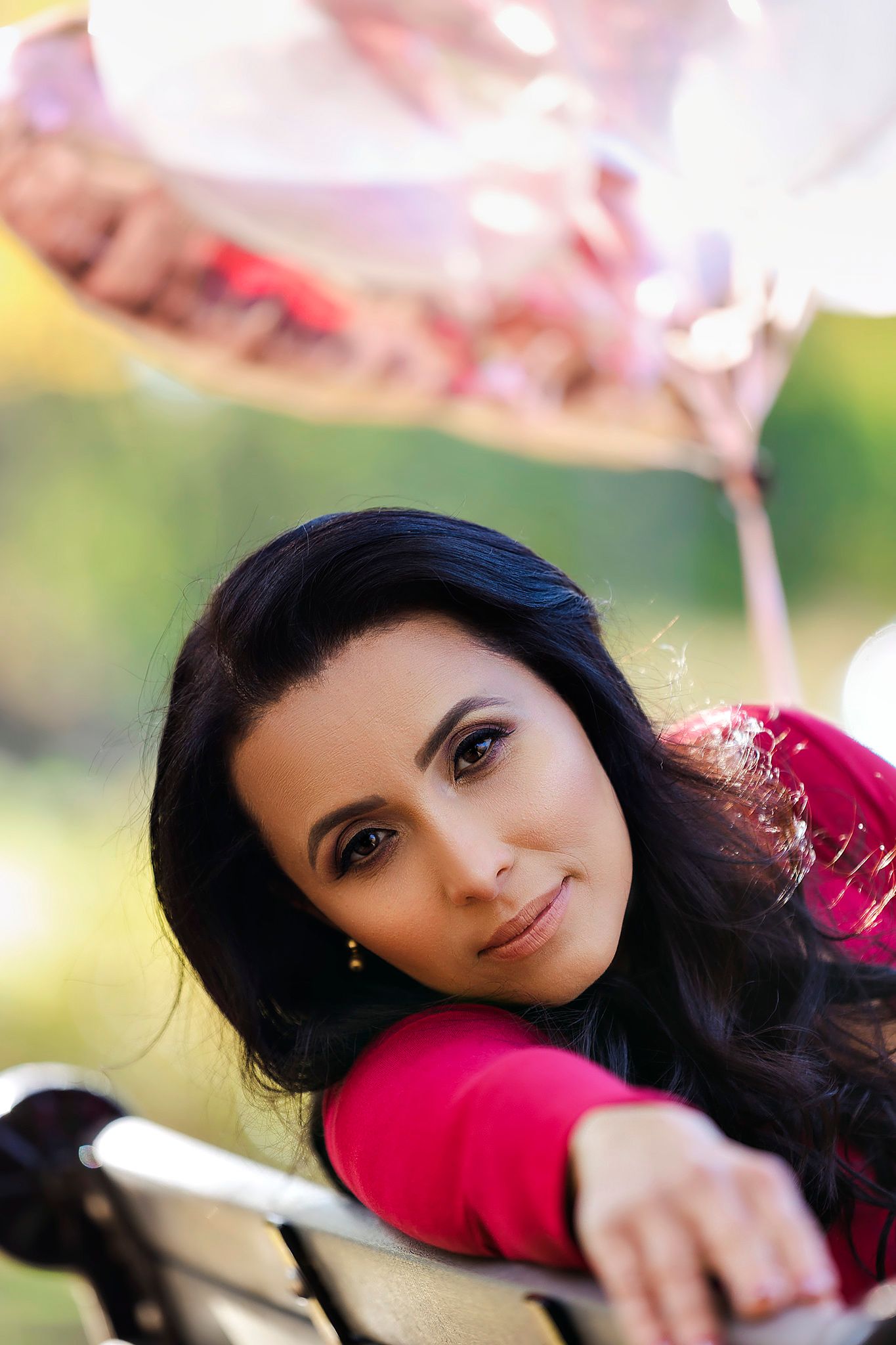 Soft focus portrait series with romantic lighting and rich red tones.