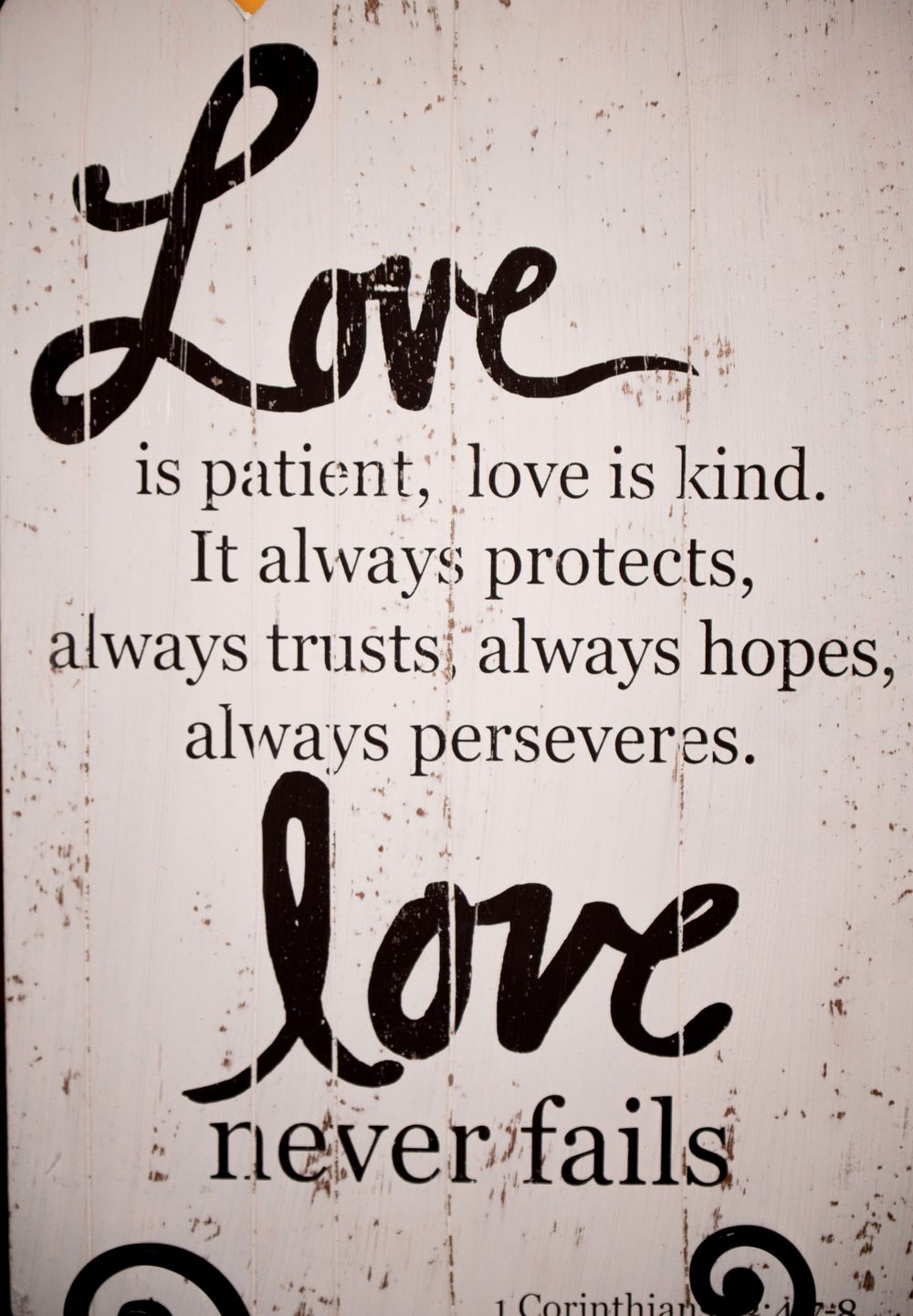 Vintage style wall art featuring the 1 Corinthians love quote in black script lettering.