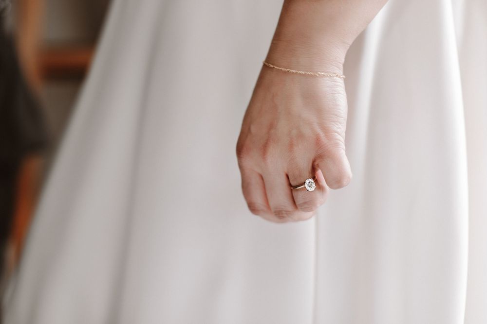 Classic white ballgown wedding dress with rich satin fabric detail.