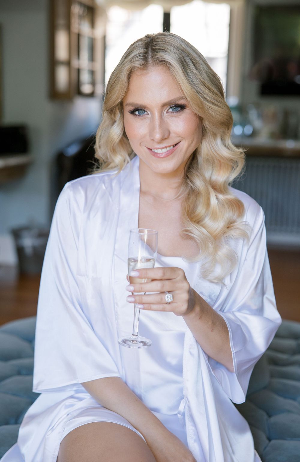 Elegant pre-wedding portrait in white silk robe.