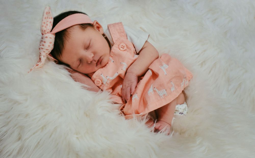 Natural window light for in-home newborn photo