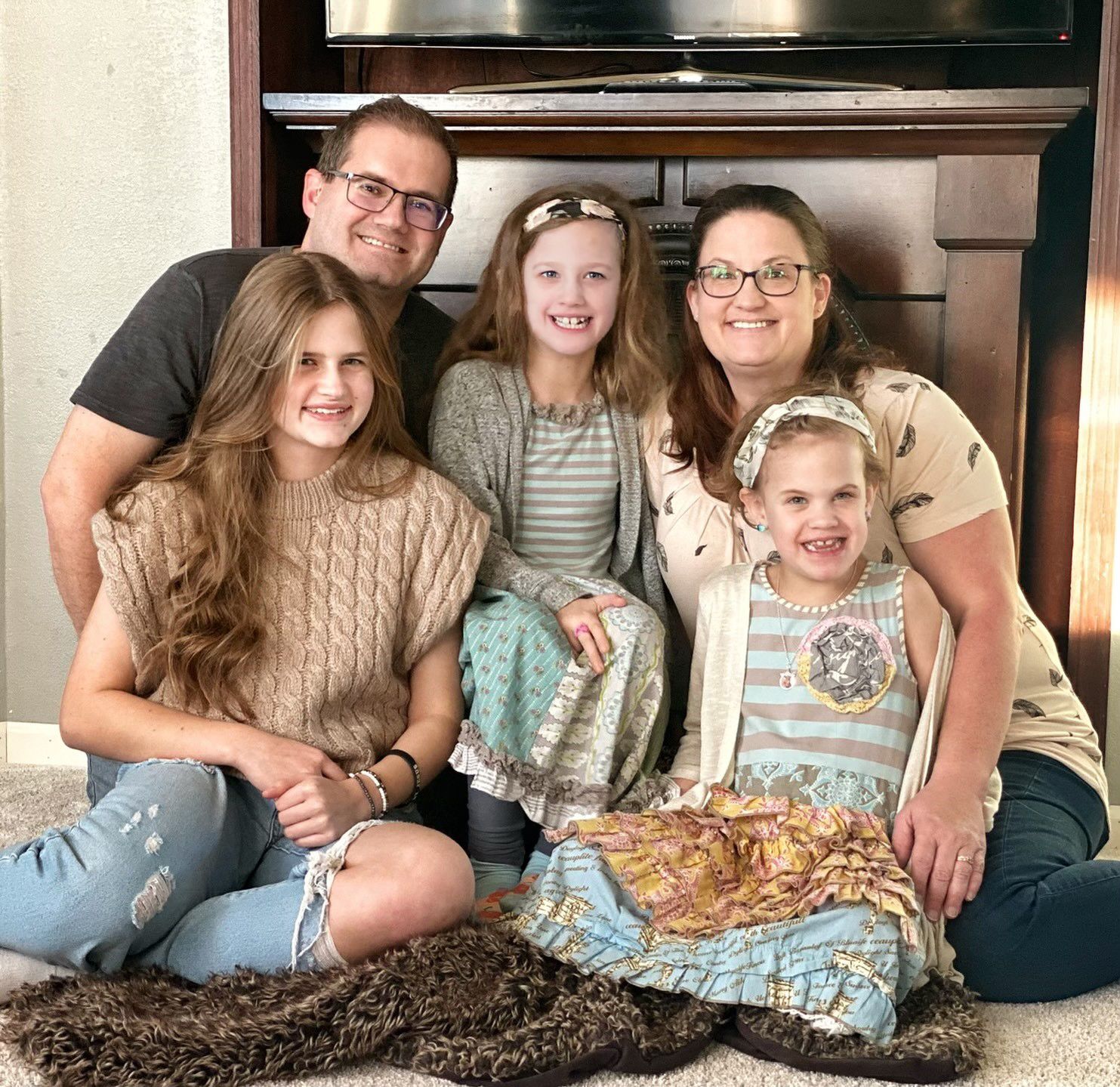 A sequence of five connected photos showing people sitting together on a couch in casual home setting.