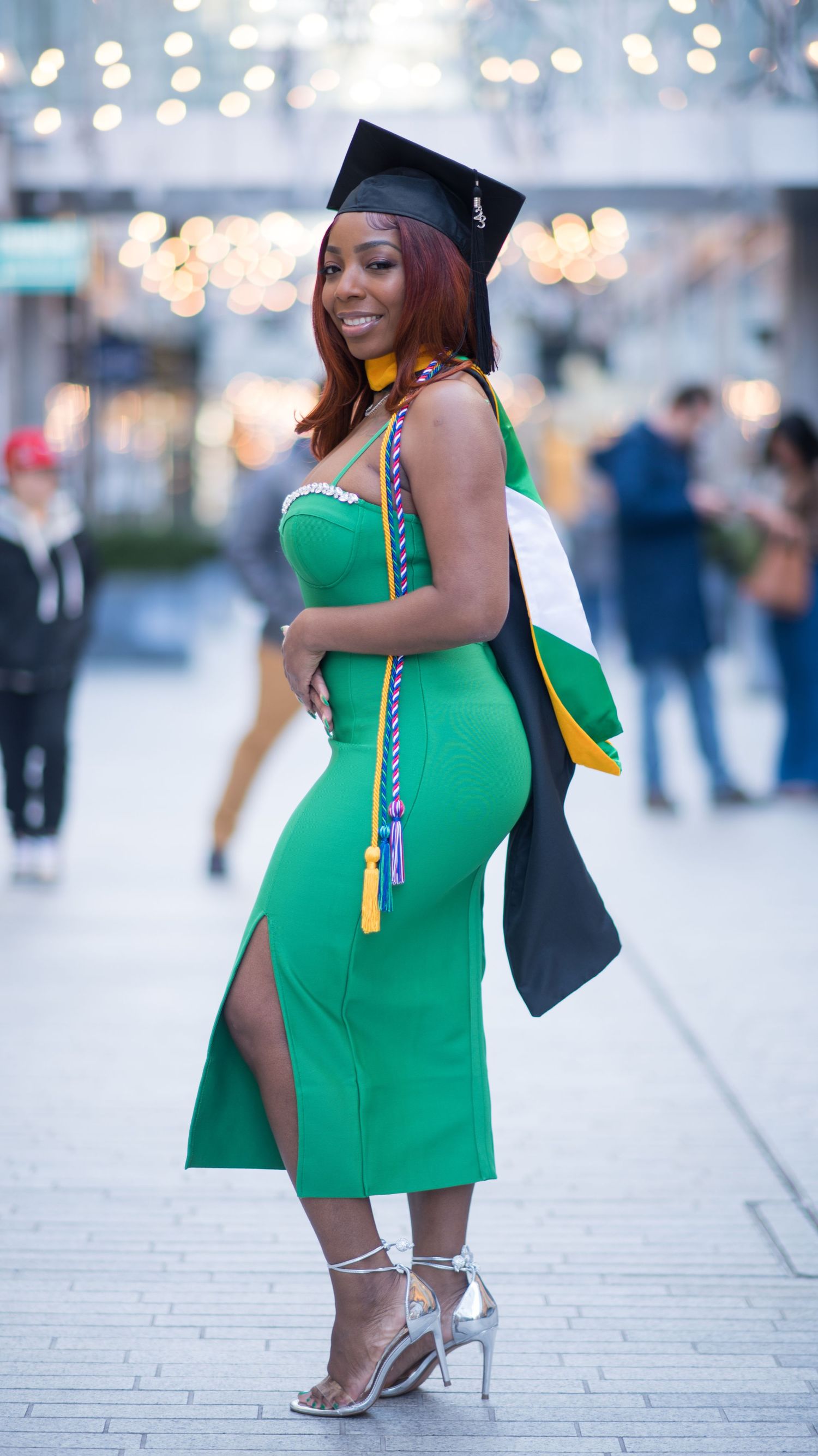 DMV Black Female Photographer captures graduation photos of recent grad at City Center in Washington, D.C.