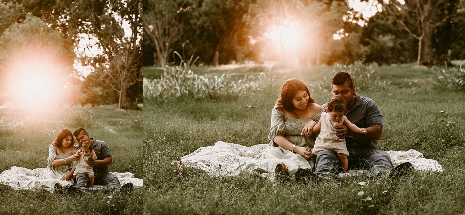 Candid family moment captured during sunset on a picnic blanket.