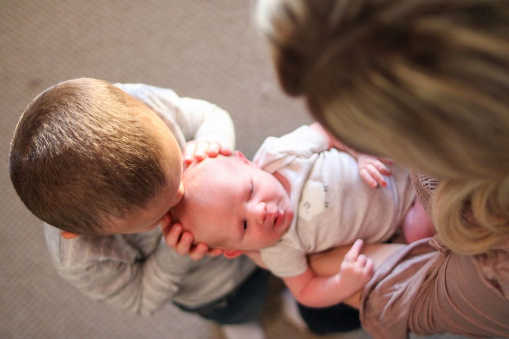 An intimate family moment captured in soft, natural lighting.