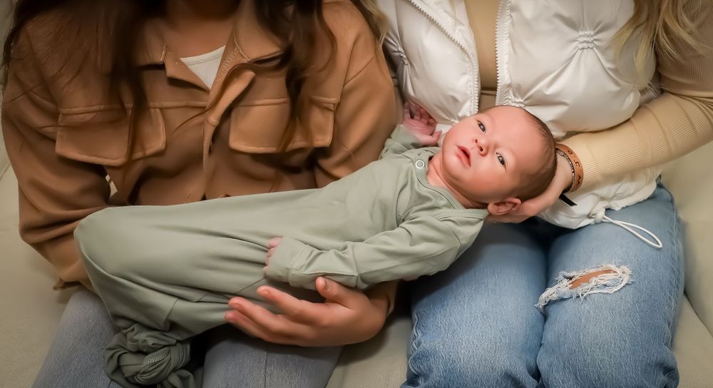 Natural lifestyle photos capturing intimate family moments with new baby.