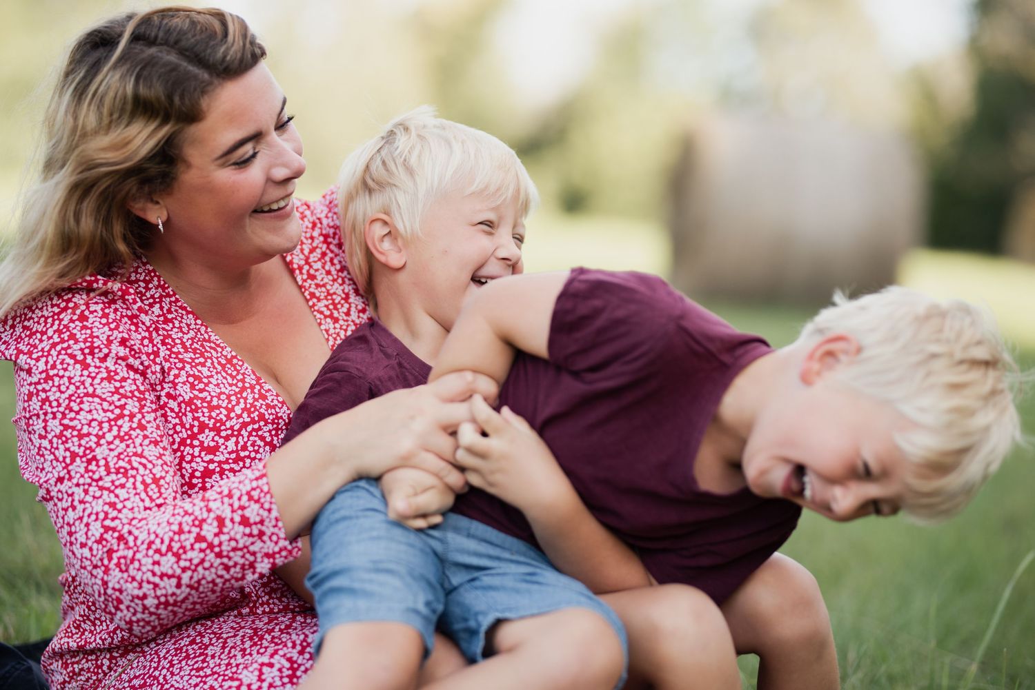 Candid laughter and joy captured during playtime in outdoor setting.
