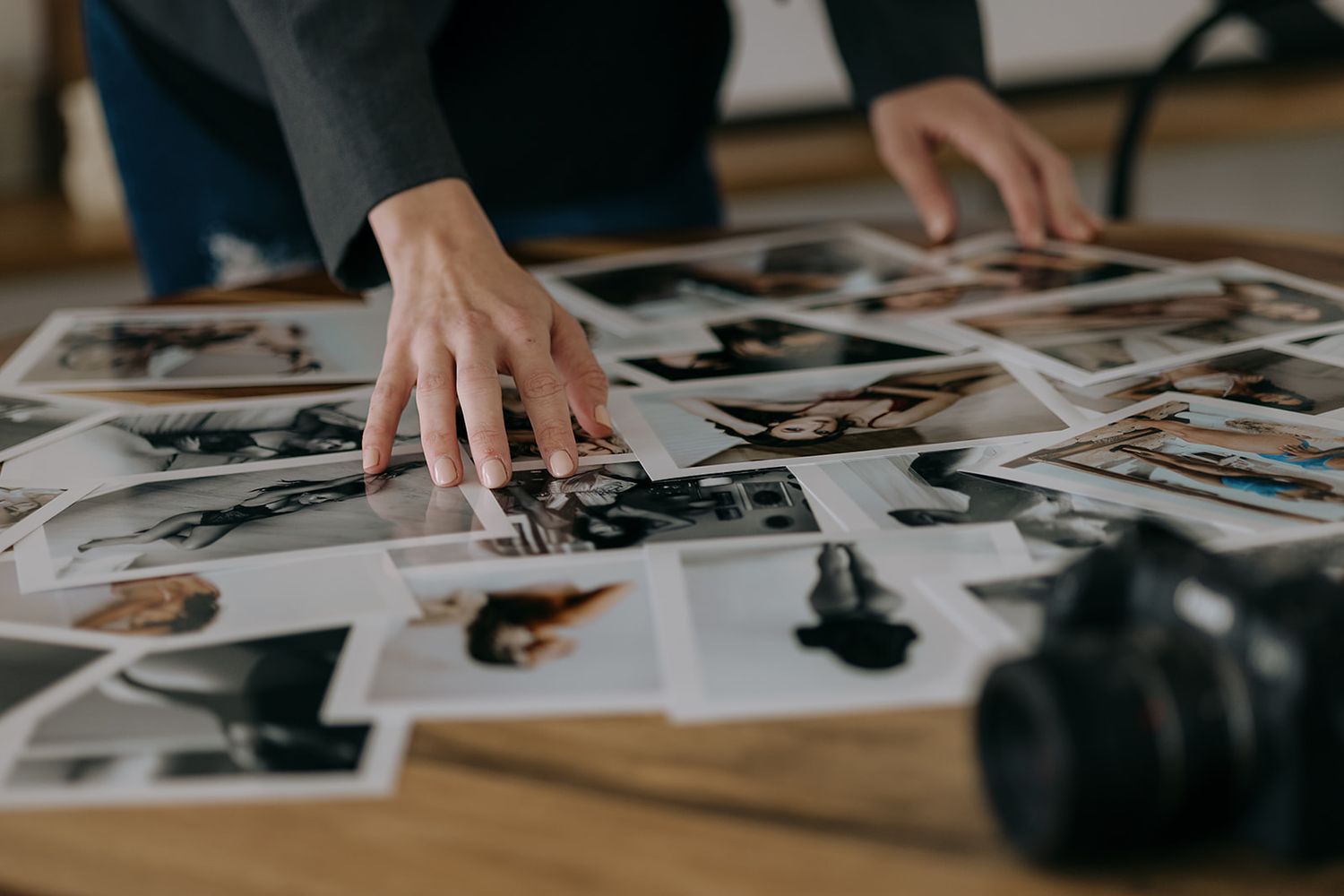 Barrie Boudoir Photographer sorting through prints.