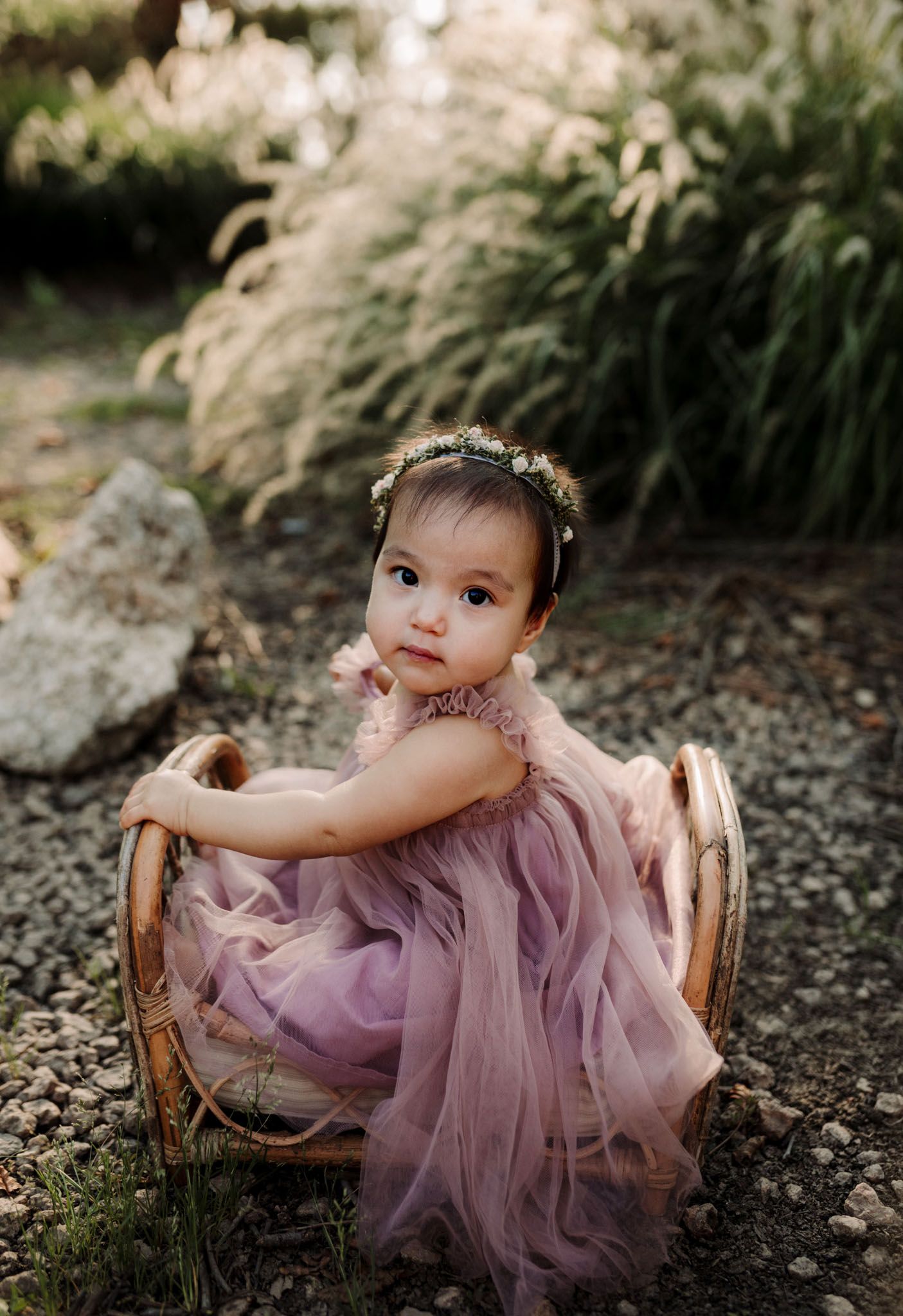 baby-girl-in-pink-dress-on-bamboo-bed-irvine-california