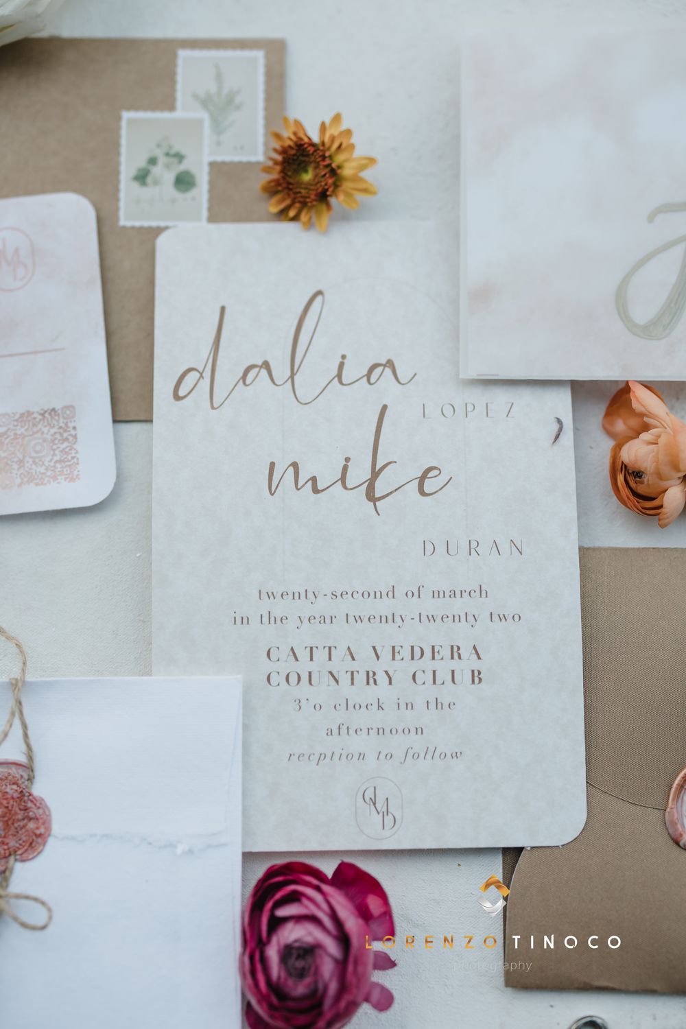 Wedding invitation with calligraphy for Dalia and Mike featuring elegant script and floral accents.