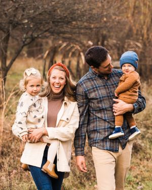 Fall photography of family with children walking towards camera