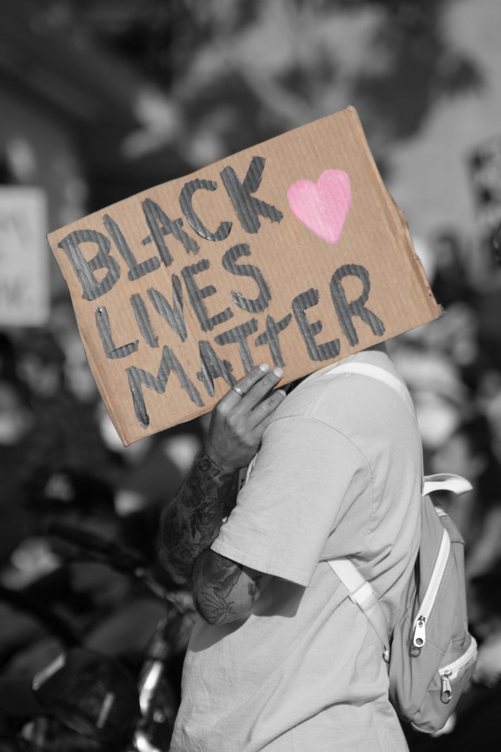 Man Holding Sign at Black Lives Matter Protest in Carlsbad, CA Black and White