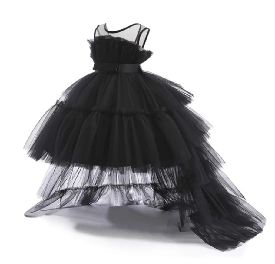 Dramatic black tulle evening gown with asymmetrical hemline and cascading layers.