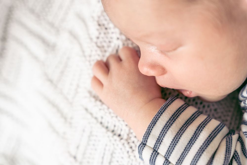 close up photograph of newborn baby sleeping