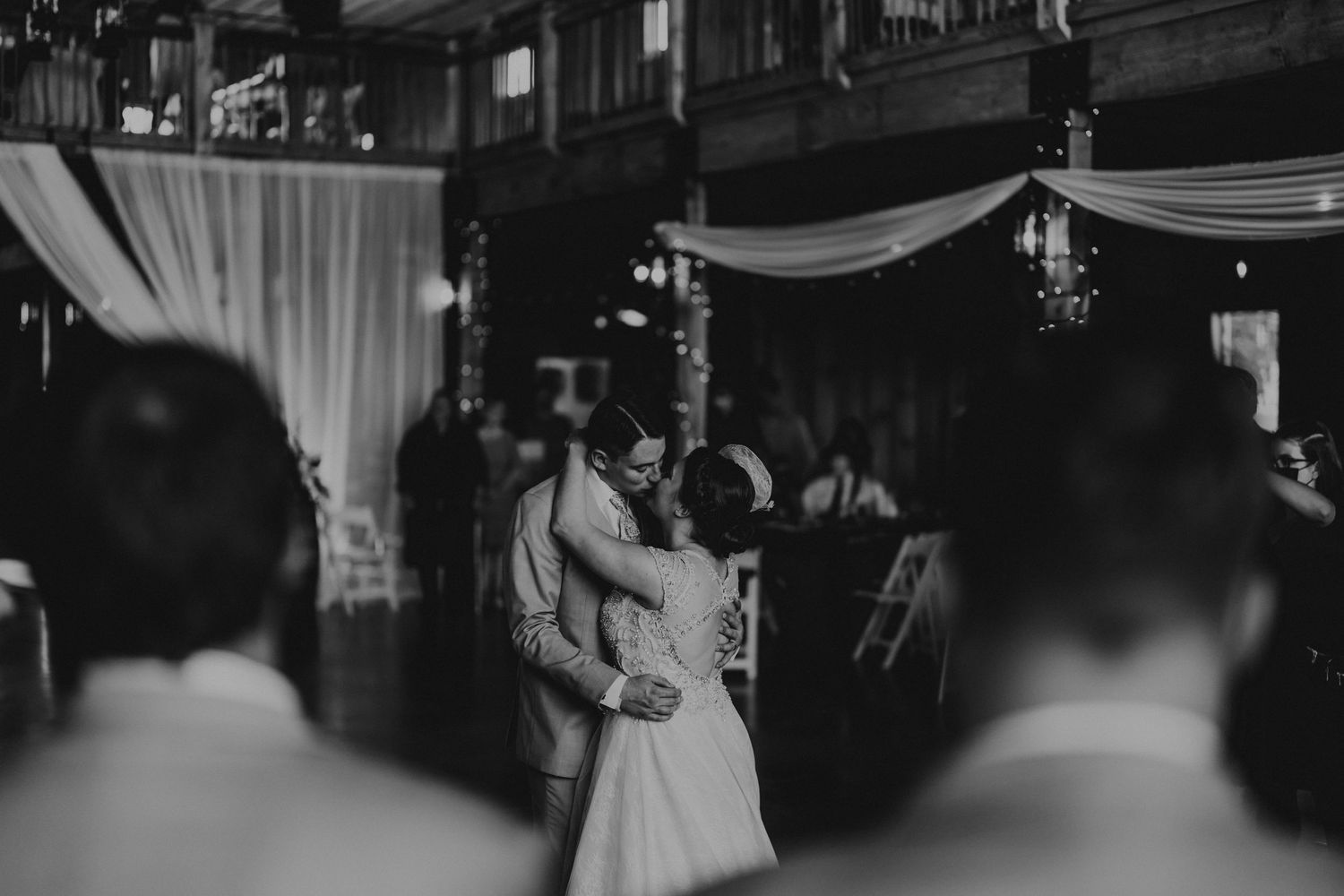 Bride and groom kissing during their first dance