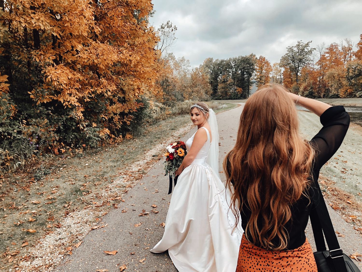 Katrina Slee photographing Bride with bouquet in Marysville, Ohio on a fall day
