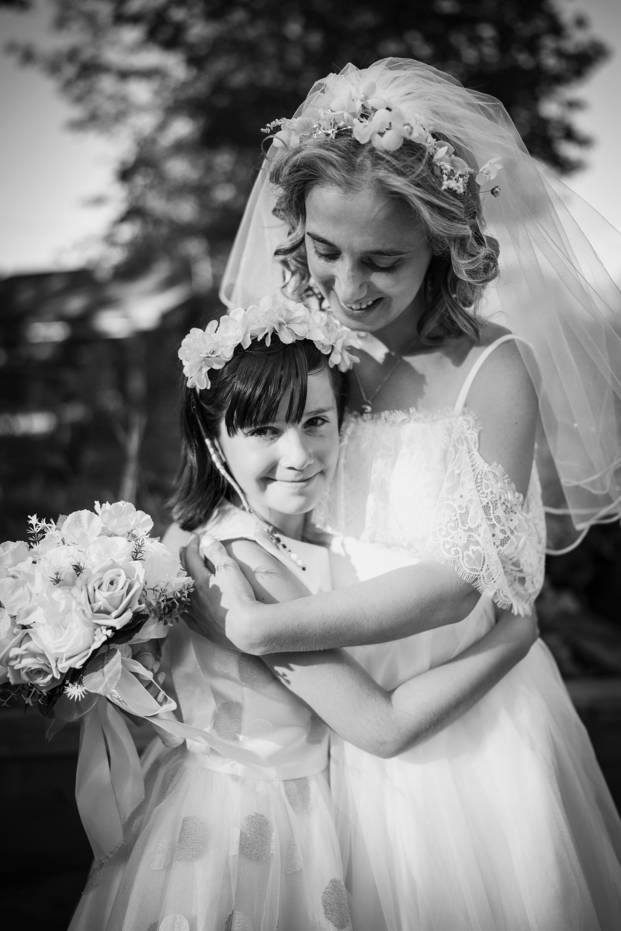 Bride embracing a child