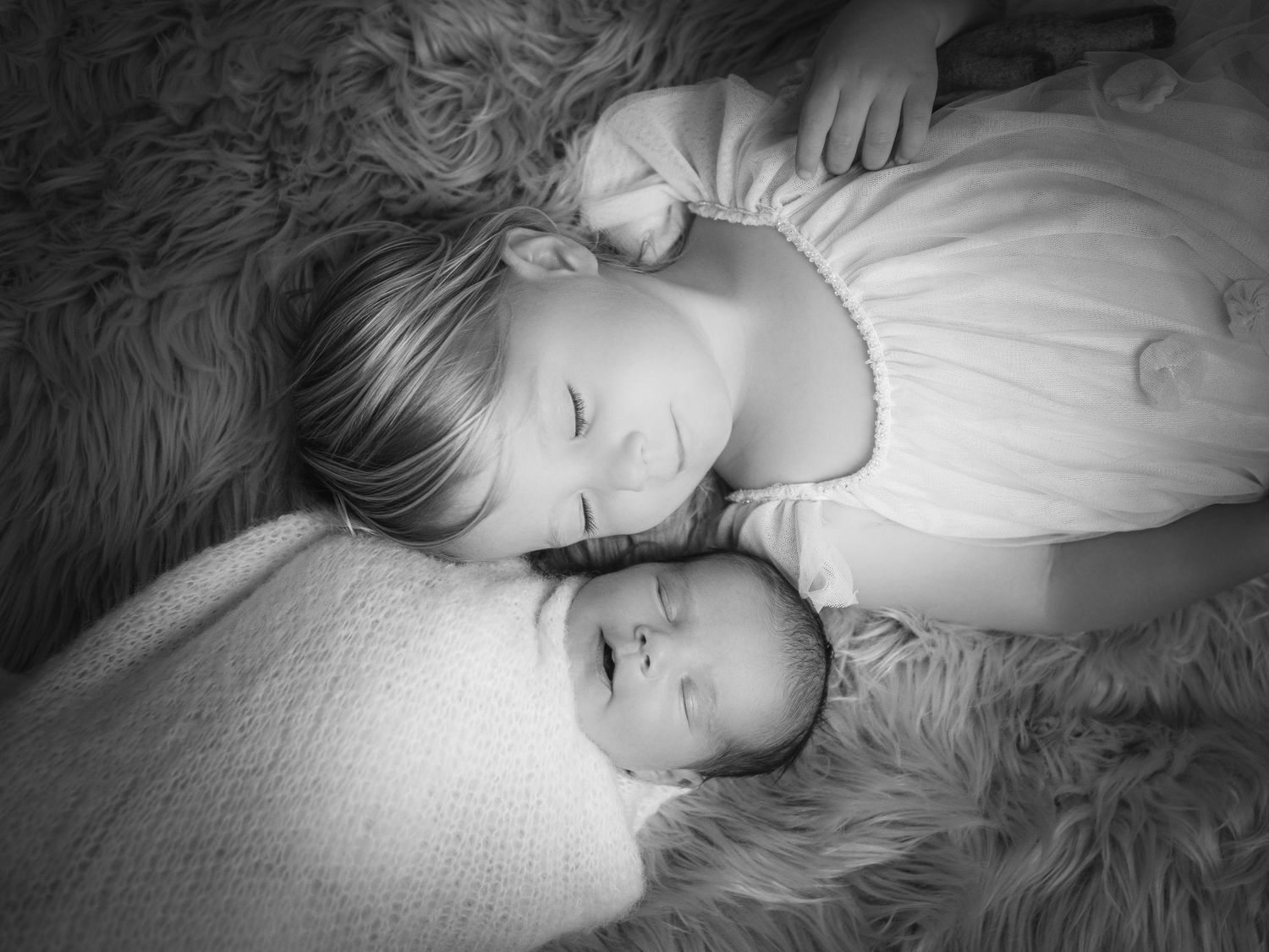 Family photography of child and newborn