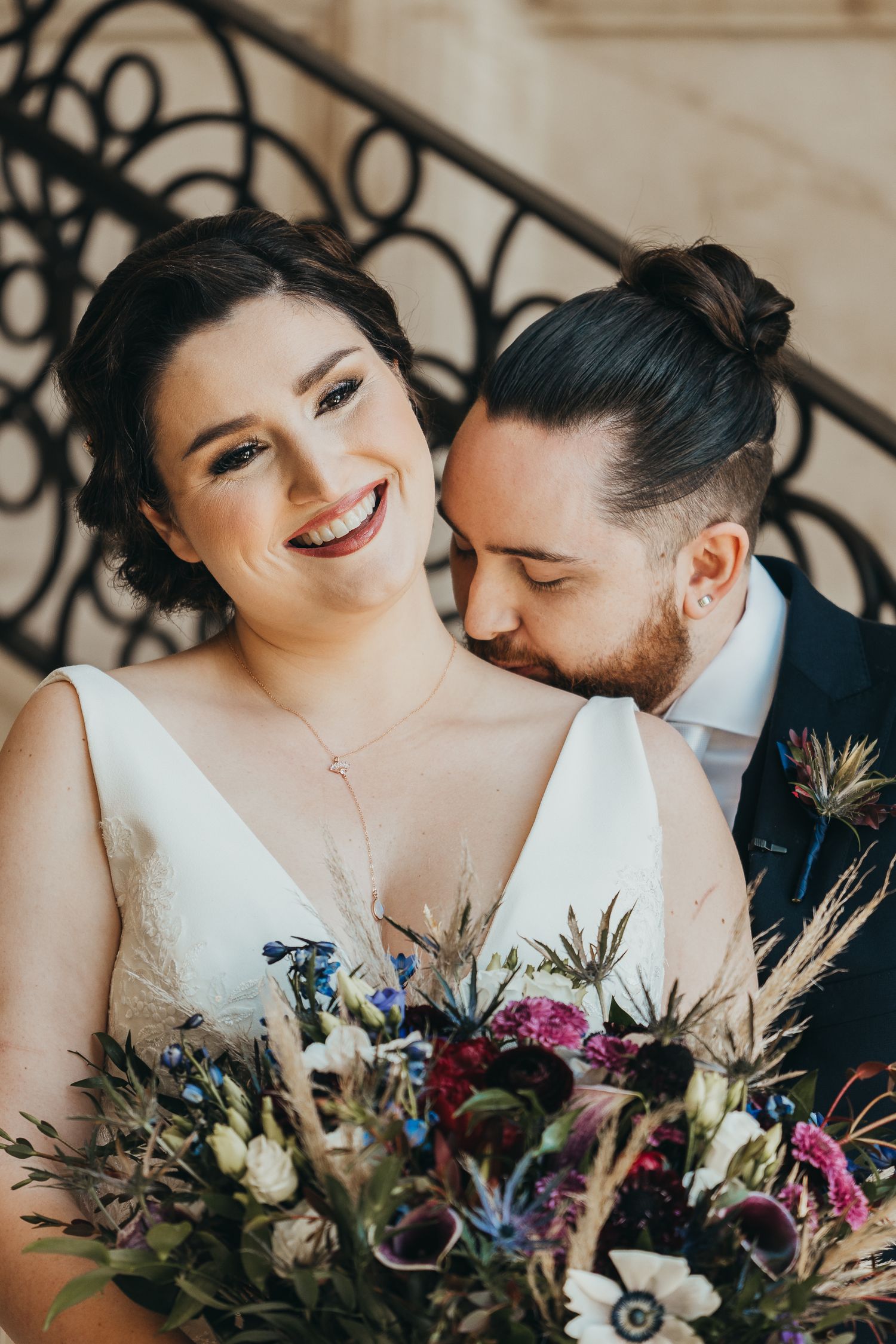 Bride and groom portrait in front of grand staircase at Four Seasons Kissimmee Florida.