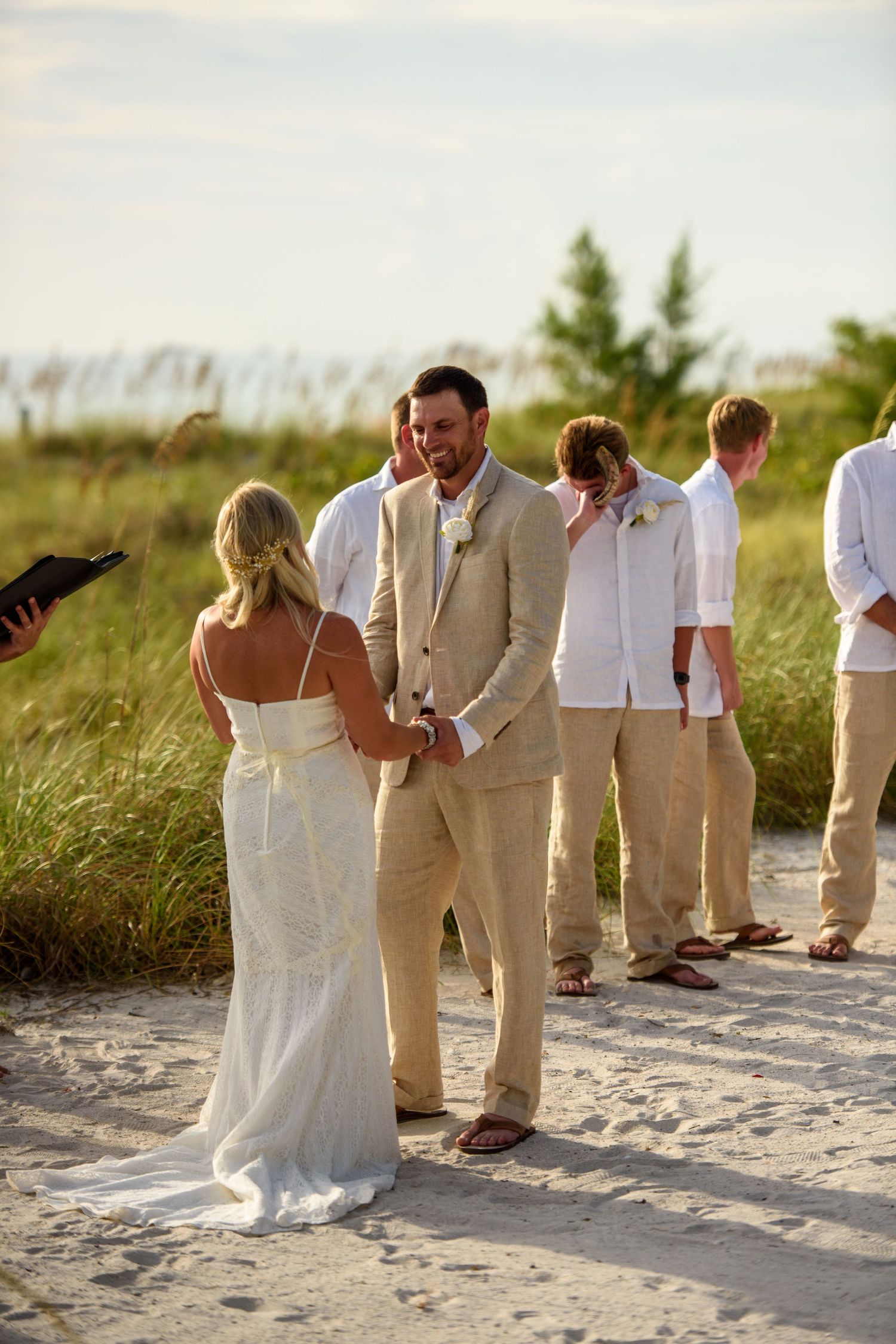 Groom looking at bride.