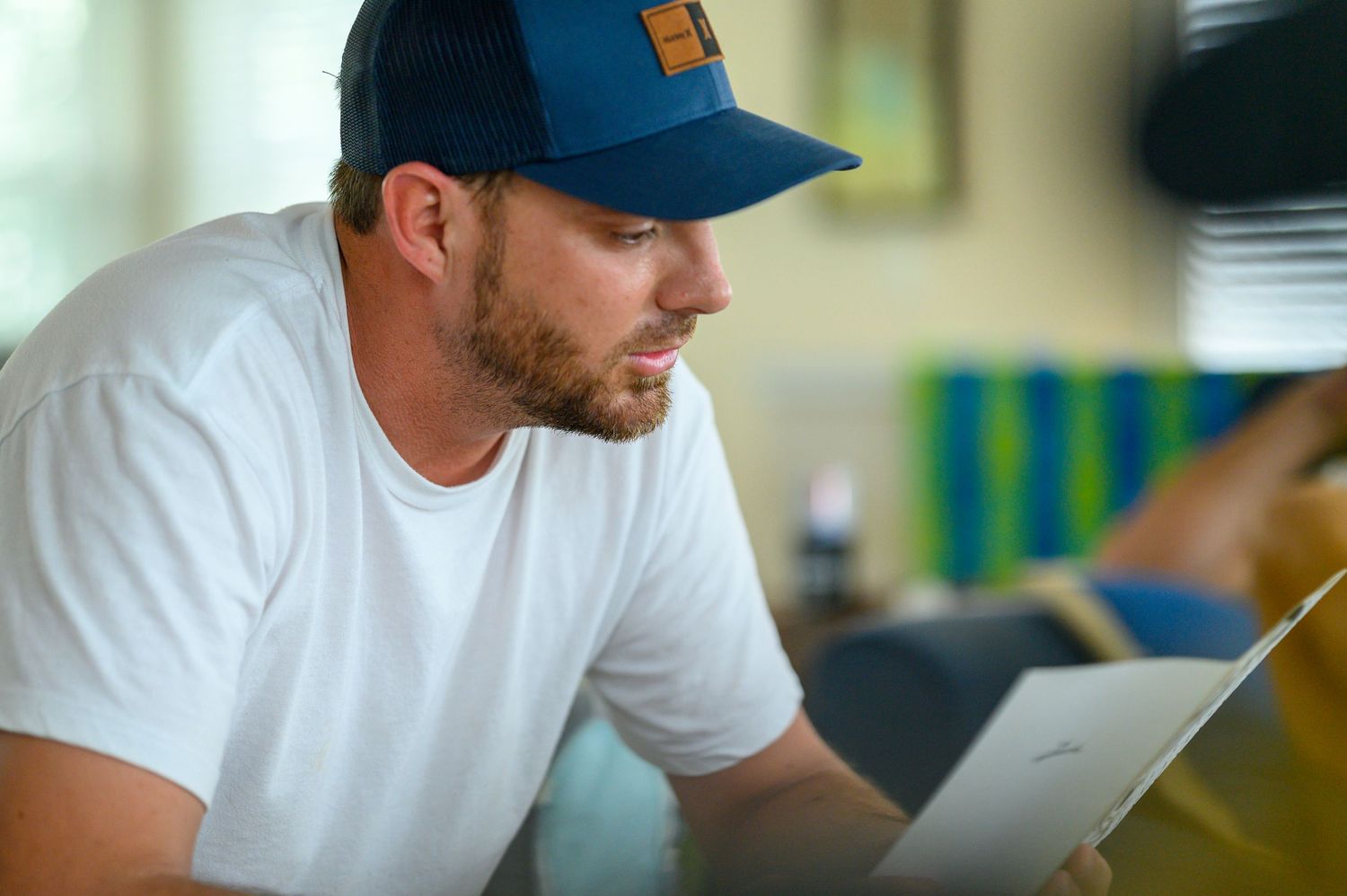 Groom reading a letter.