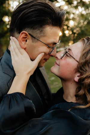 Intimate close-up moments shared between two people wearing glasses.