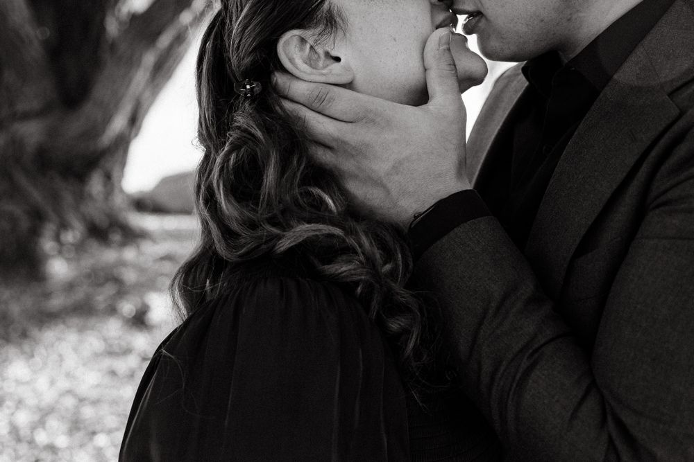 Intimate black and white close-up portraits capturing tender moments between a couple.