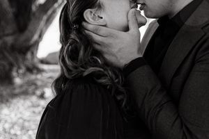Intimate black and white close-up portraits capturing tender moments between a couple.